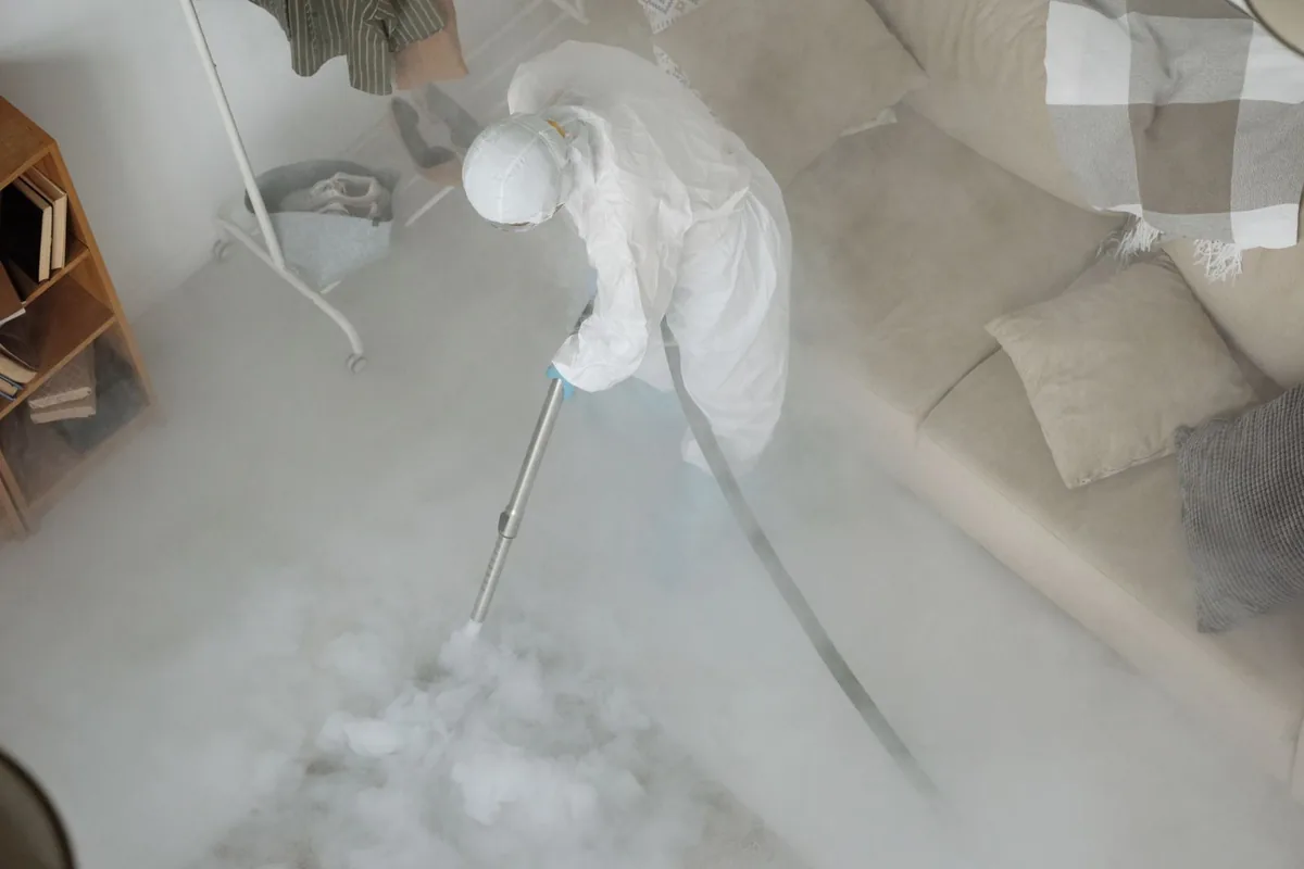 Biohazard cleanup technician in protective equipment, Ferndale, MI